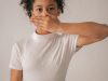 worried black girl covering mouth